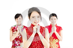 Happy chinese new year.woman with congratulation gesture