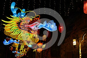 Happy Chinese new year, year of the dragon, zodiac sign hanging beautiful lantern at night