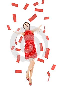 Happy chinese new year.young woman trying to catch red envelope