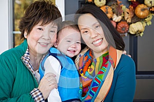 Happy Chinese Senior Adult Grandmother with Her Daughter and Grandson