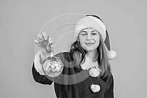 happy christmas child girl wear red santa claus hat and costume hold tree decoration, preparation