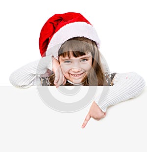 Happy Christmas girl with santa hat points down. isolated on white