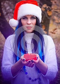 Happy Christmas holidays, girl with a candle