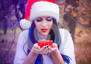 Happy Christmas holidays, girl with a candle