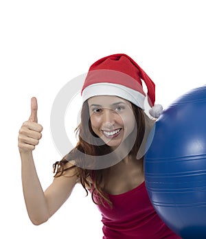Happy christmas pilates woman thumb up photo