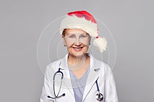 Happy Christmas woman doctor Santa on white background