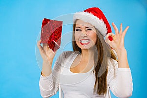 Happy Christmas woman holds gift bag