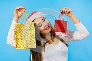 Happy Christmas woman holds gifts bag