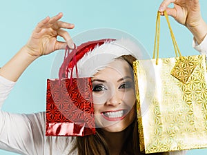 Happy Christmas woman holds gifts bag