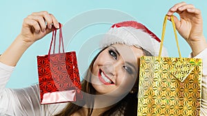 Happy Christmas woman holds gifts bag