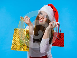 Happy Christmas woman holds gifts bag