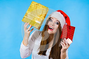 Happy Christmas woman holds gifts bag