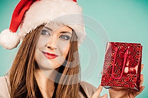 Happy Christmas woman holds red gift bag