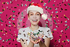 Happy Christmas woman Santa on confetti rain on pink banner background