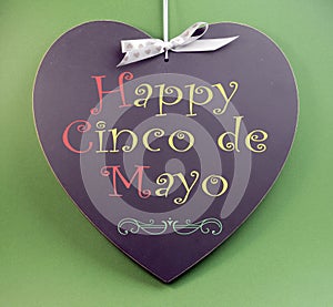 Happy Cinco de Mayo, 5th May, event reminder handwriting greeting on heart shaped blackboard