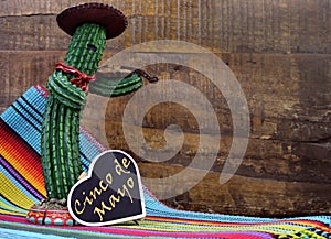 Happy Cinco de Mayo, 5th May, party celebration with with fun Mexican cactus and blackboard sign