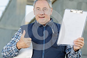 Happy civil engineer showing thumb-up photo