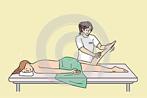 Happy client relax on table in massage saloon