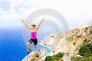 Happy climber woman winner reaching life goal success