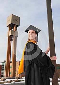 Happy college graduate on campus