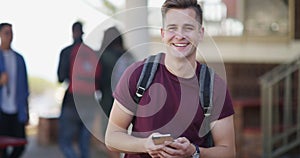 Happy college student, man and phone with face, texting or laughing with funny meme at campus. Person, smartphone and