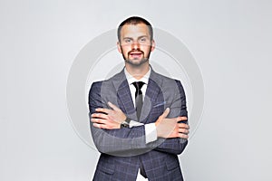 Happy confident caucasian professional in black suit isolated on white background