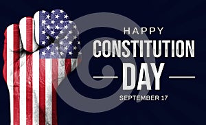 Happy Constitution Day of the United States of America background design with painted fist and typography greetings on the side.