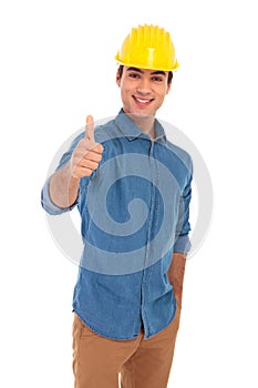 Happy construction egineer making the ok thumbs up sign photo
