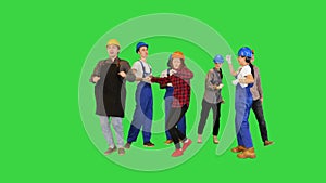 Happy construction people dancing in a circle on a Green Screen, Chroma Key.