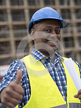 Happy construction worker thumbs up