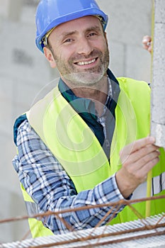 happy constructor and worker outdoors