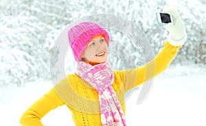 Happy cool girl taking picture self portrait on smartphone