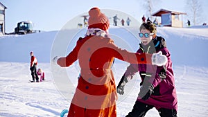 Happy coulple dating in mountain ski resort at sunny day. Winter, sport, holidays, relationship, love, xmas, lifestyle