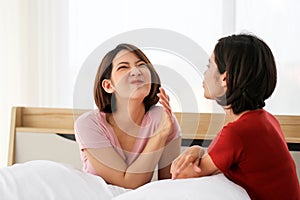 Happy Couple  asia woman  bored with bad breath in bedroom morning
