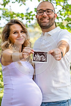 Happy couple with baby scan