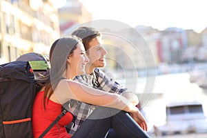 Couple of backpackers sightseeing on vacation photo