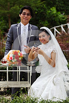 Happy couple at the banquet table on field