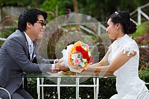 Happy couple at the banquet table on field