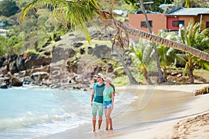 Happy young couple in honeymoon on the beach enjoy romatic vacation