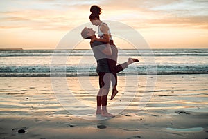 Happy couple at beach hug and love celebration on romantic sunset tropical ocean water hawaii luxury vacation travel or