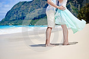 Happy couple at the beach in a romantic mood