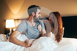 Happy couple in bedroom