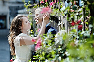 Happy couple bride and groom tender caress in wedding day in Italy