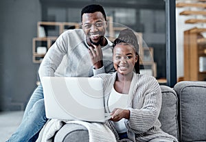 Happy couple browsing on a laptop, banking online and applying for a home loan, mortgage bond or insurance. Portrait of