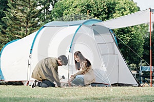 Happy couple camping life at park