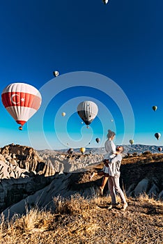 Happy couple in Cappadocia. The man proposed to the girl. Honeymoon in Cappadocia. Couple at the balloon festival. Couple travels photo