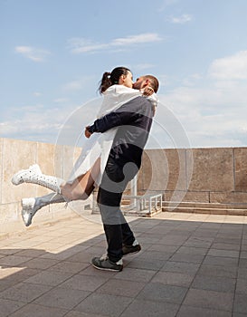 Happy couple celebrating relationship anniversary on building rooftop