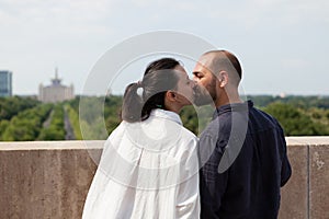 Happy couple celebrating relationship anniversary on tower terrace