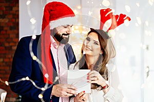 Happy couple with Christmas surprise gift