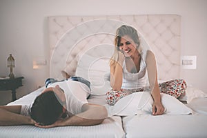 Happy couple conversation in bed